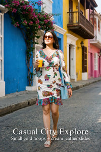 Pretty Pixie white floral wrap ruffle-hem long-sleeve mini dress styled for casual city exploring