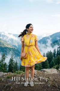 Woman in Pretty Pixie sunshine yellow floral smocked mini dress styled for a hill station trip