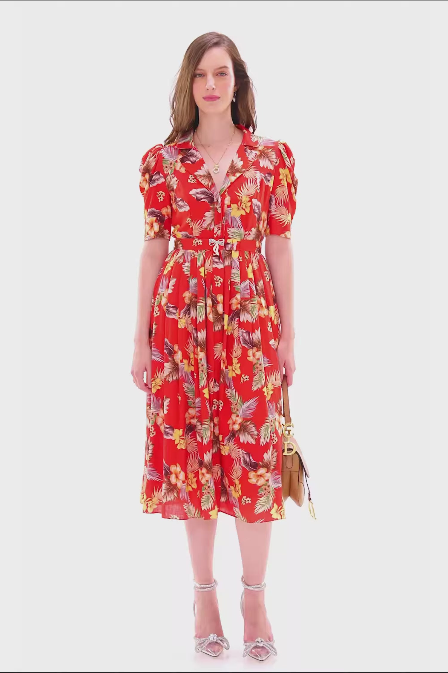 Red floral collared midi dress with short sleeves and belted waist.