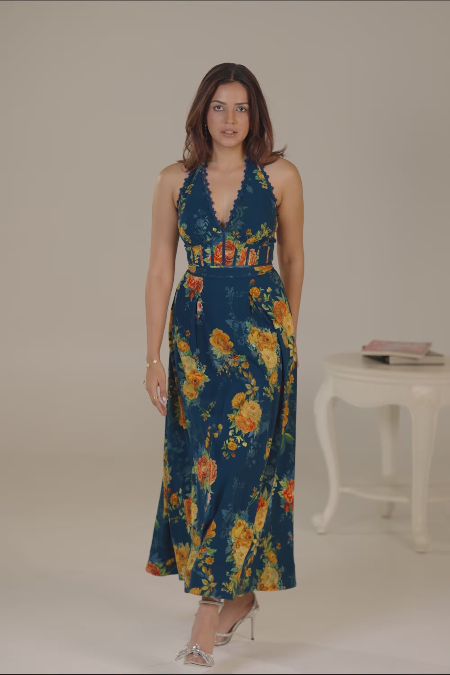 Dark teal halter neck floral maxi dress with garden backdrop
