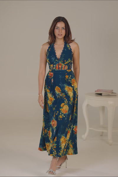 Dark teal halter neck floral maxi dress with garden backdrop