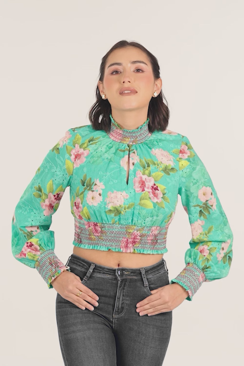 woman wearing green floral smocked crop top with full sleeves, stylish casual fashion
