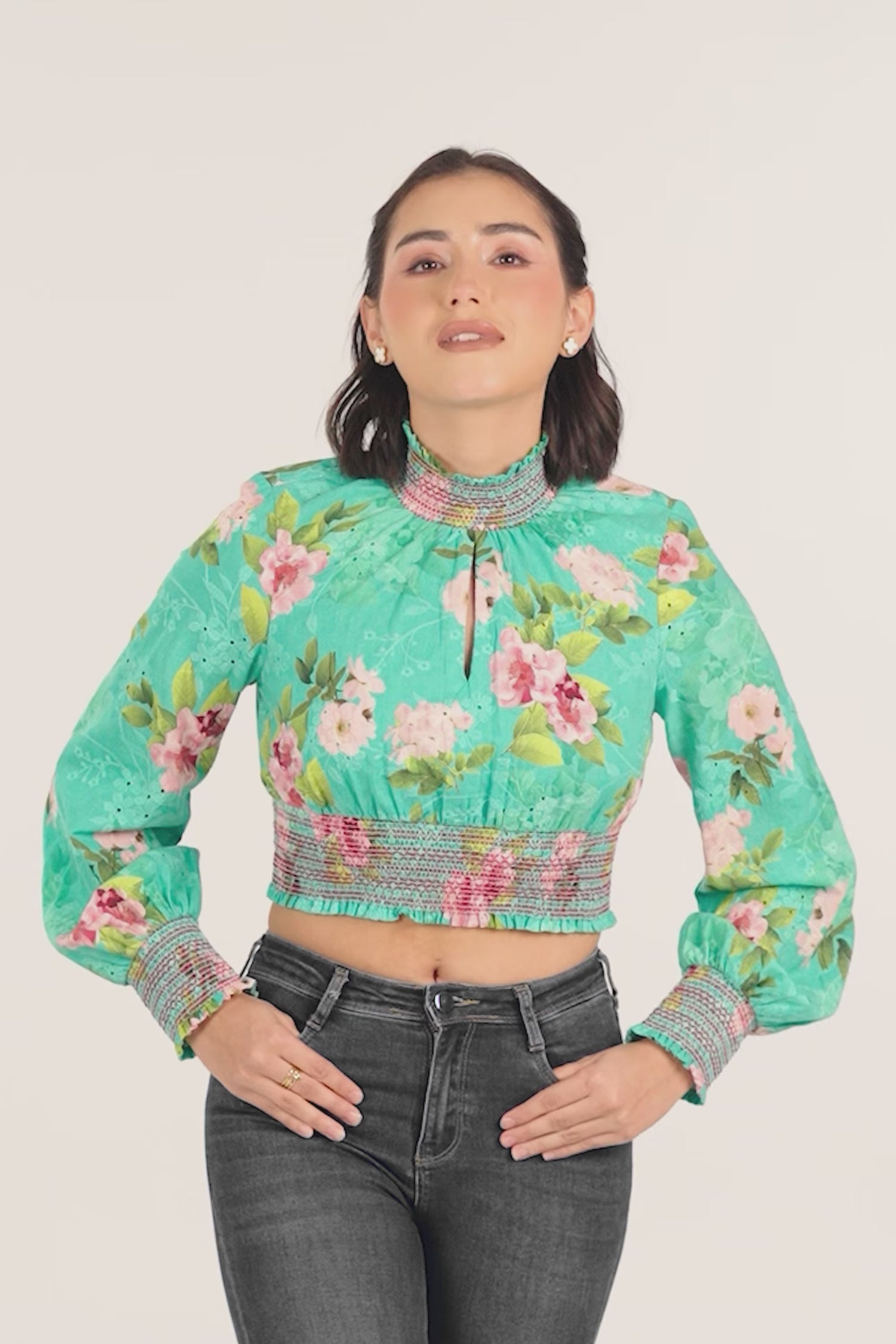 woman wearing green floral smocked crop top with full sleeves, stylish casual fashion