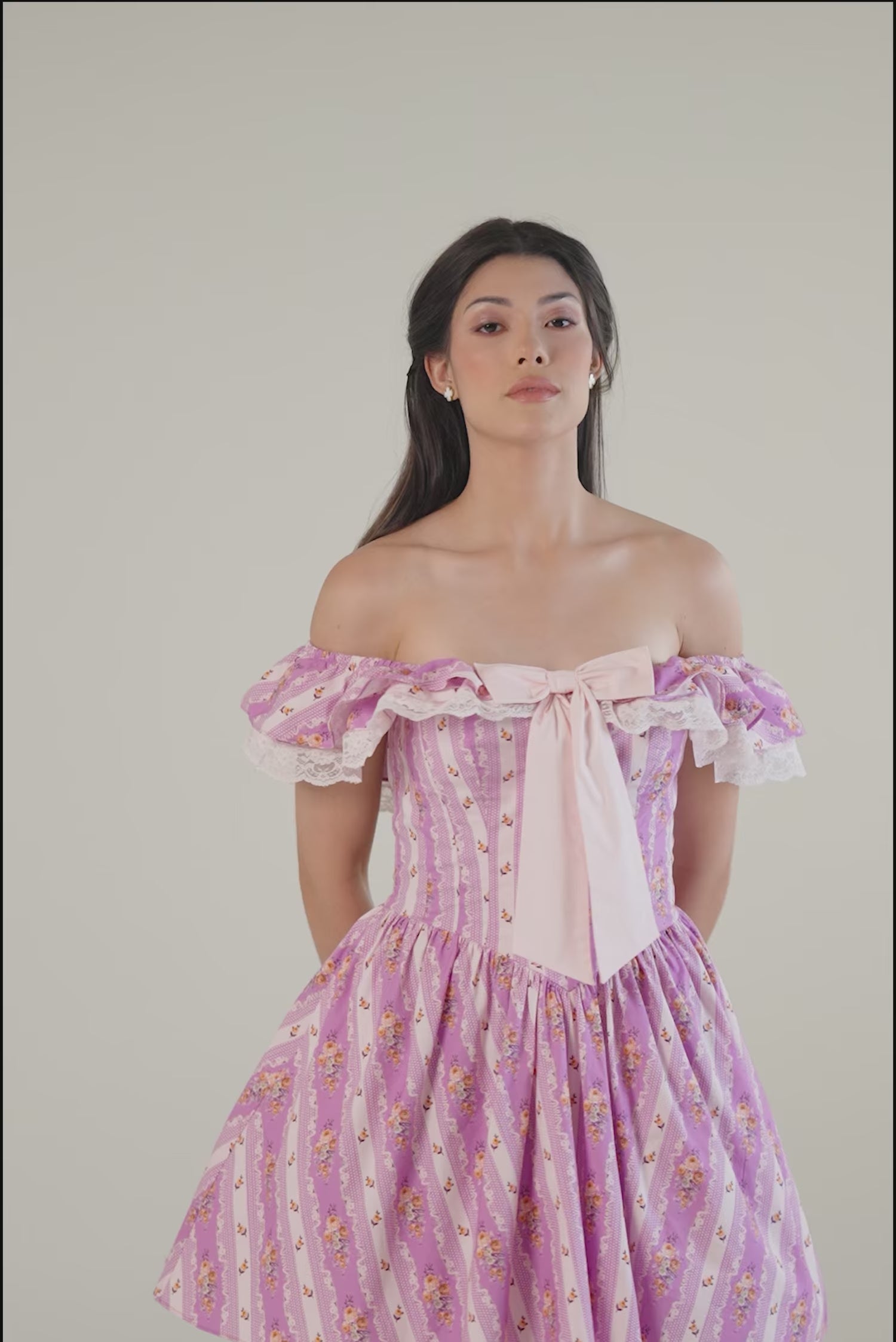 Purple floral off-shoulder mini dress showing tulle underskirt and lace trim