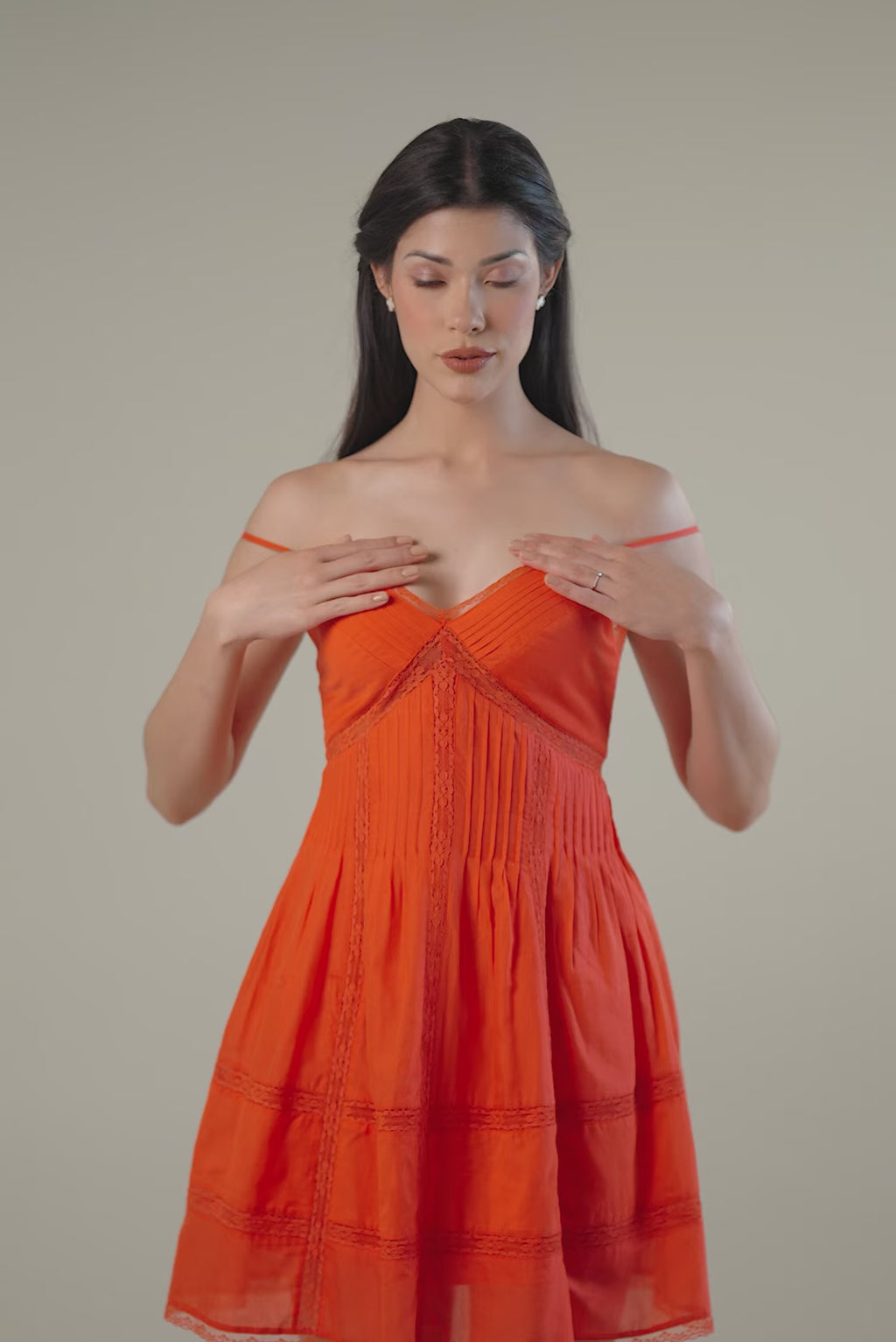  red-orange strappy mini dress with V-neckline and lace trim, perfect summer outfit
