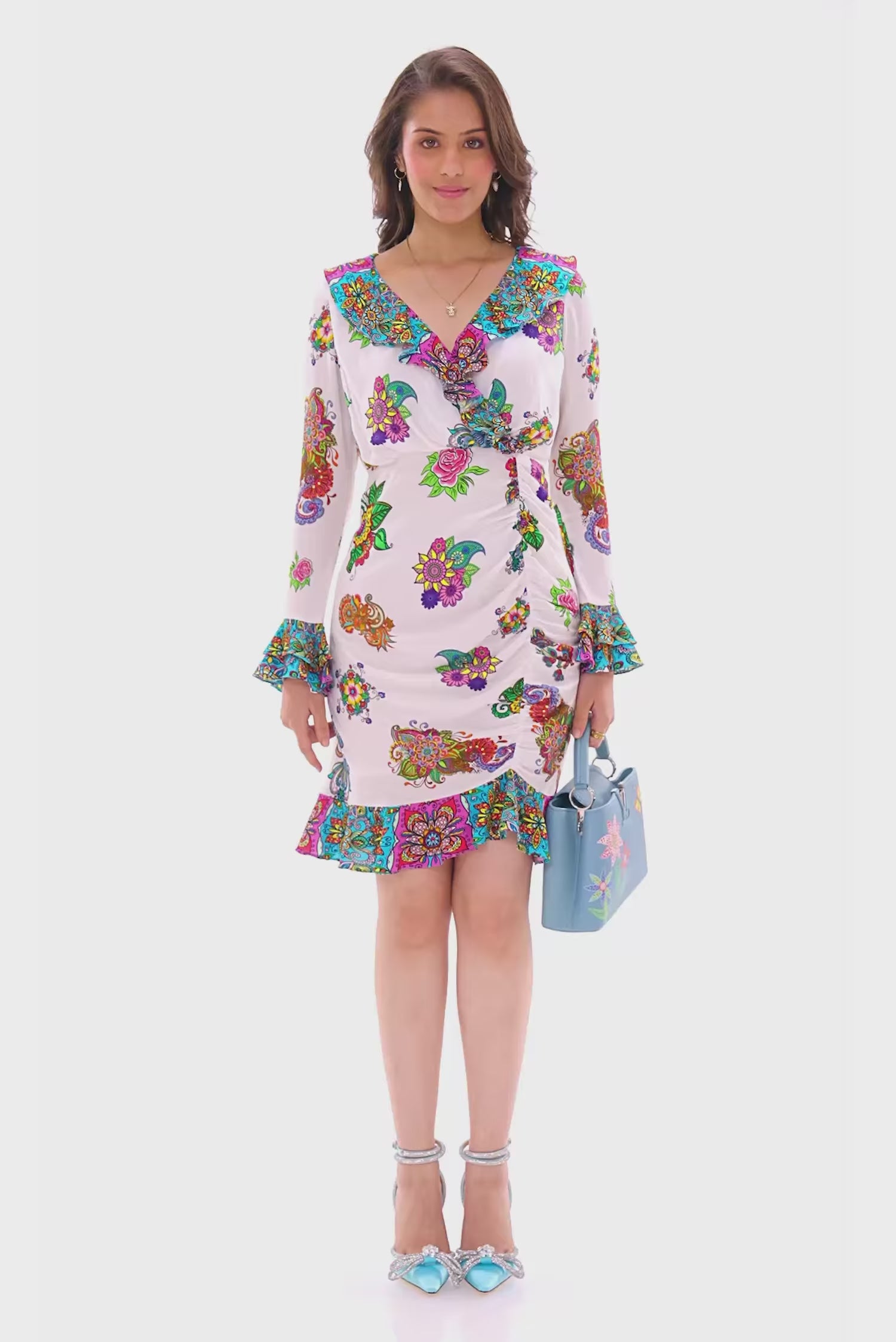 White floral wrap mini dress with long sleeves and ruffle hem