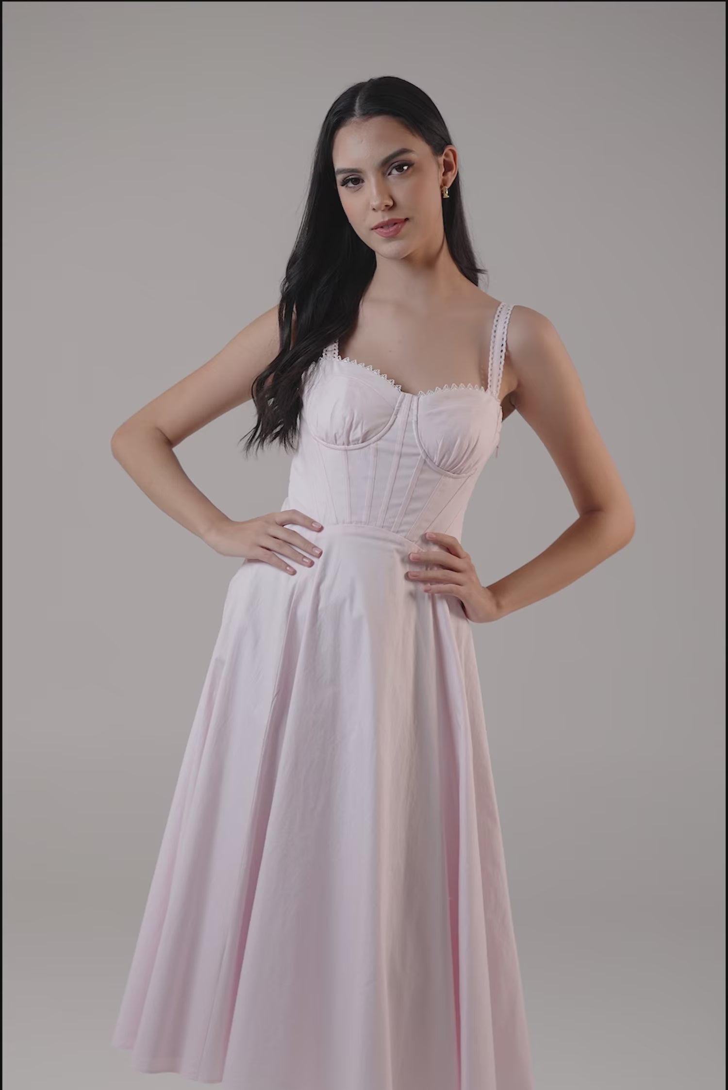 soft pink corset-style midi dress with fitted bodice and flared skirt, perfect for formal occasions.