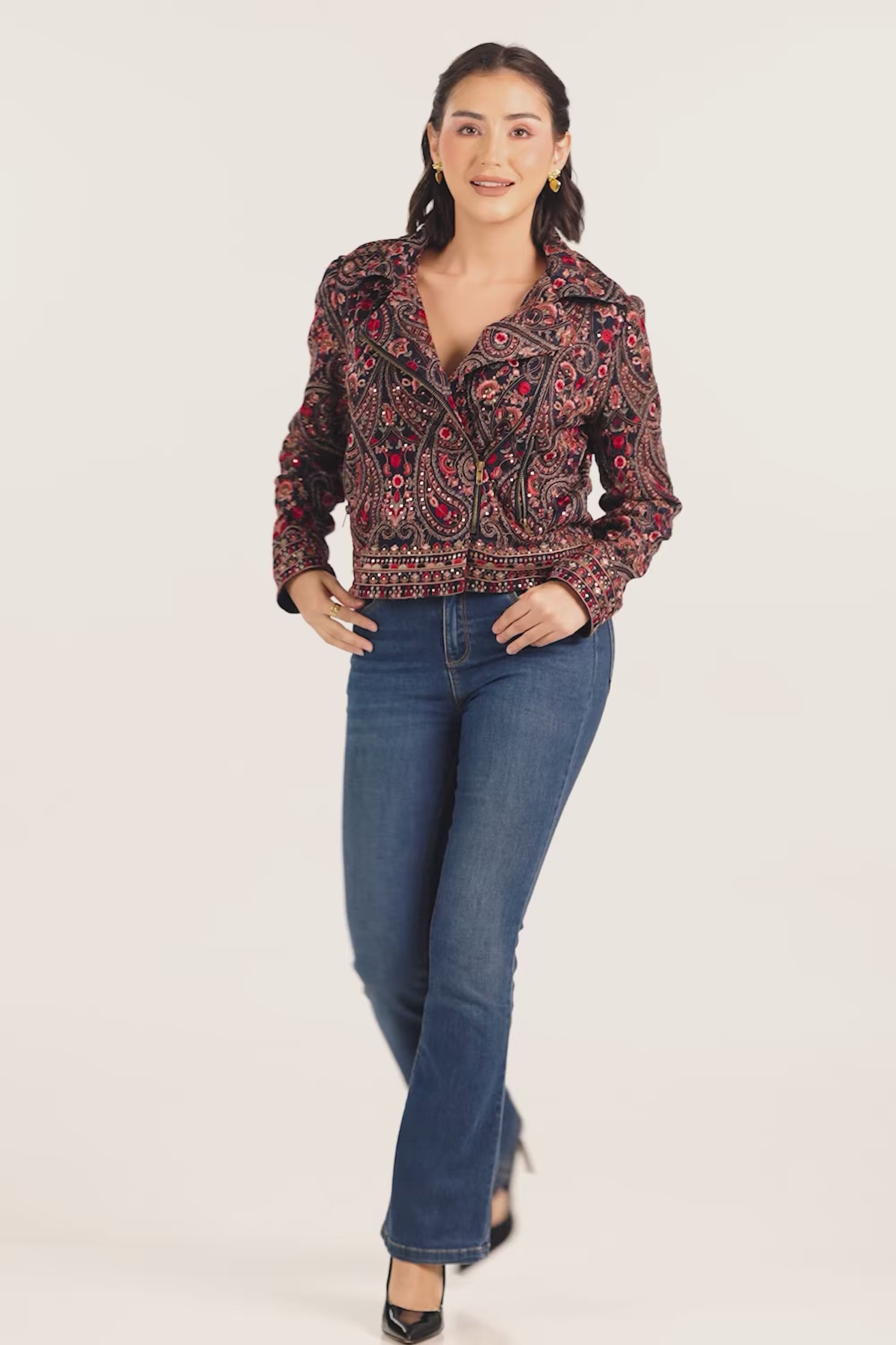 Women wearing a handcrafted embroidered paisley jacket for women by Pretty Pixie, styled with blue jeans – boho chic outerwear from India.