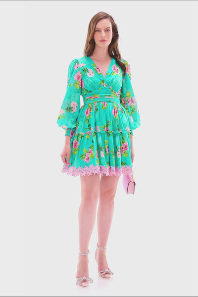turquoise floral lace mini dress with long sleeves and pink lace hem