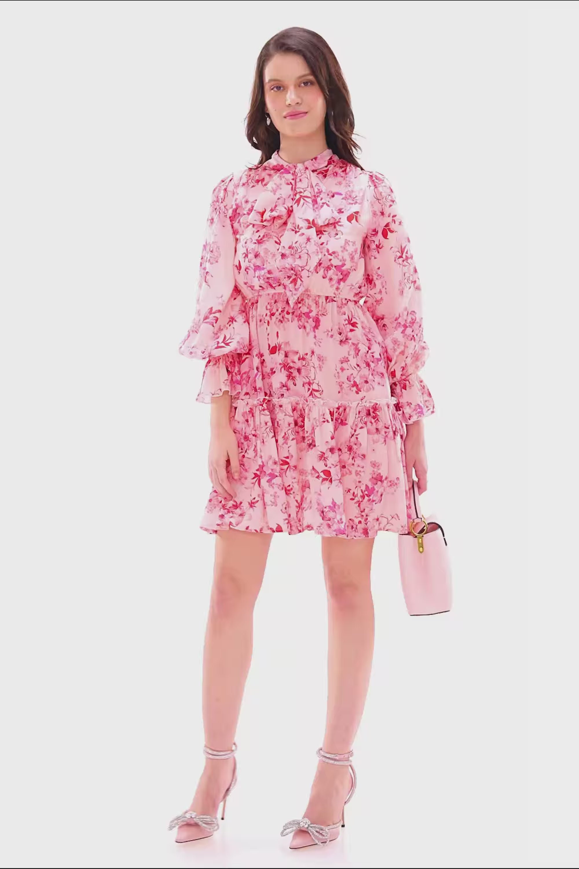 Pink floral ruffle mini dress with bow neck tie and flared hemline