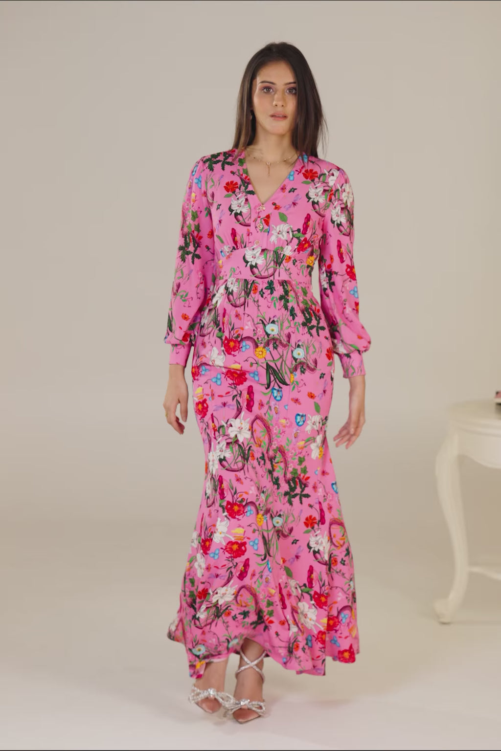 Full length of pink floral maxi dress with long sleeves