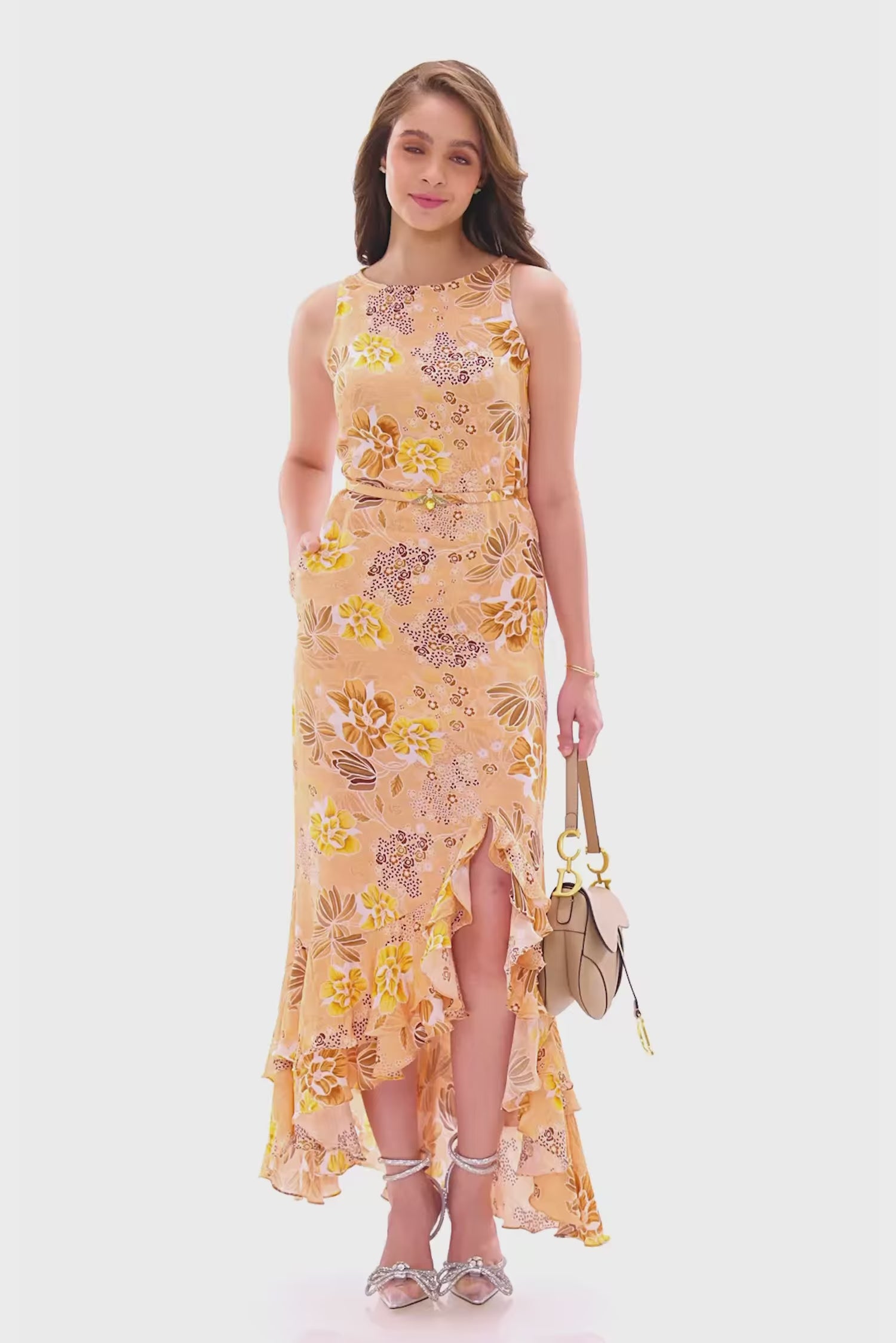 Peach floral sleeveless ruffle maxi dress with slit.