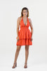 orange halter layered mini dress with deep V neckline and flared tiers, styled with heels