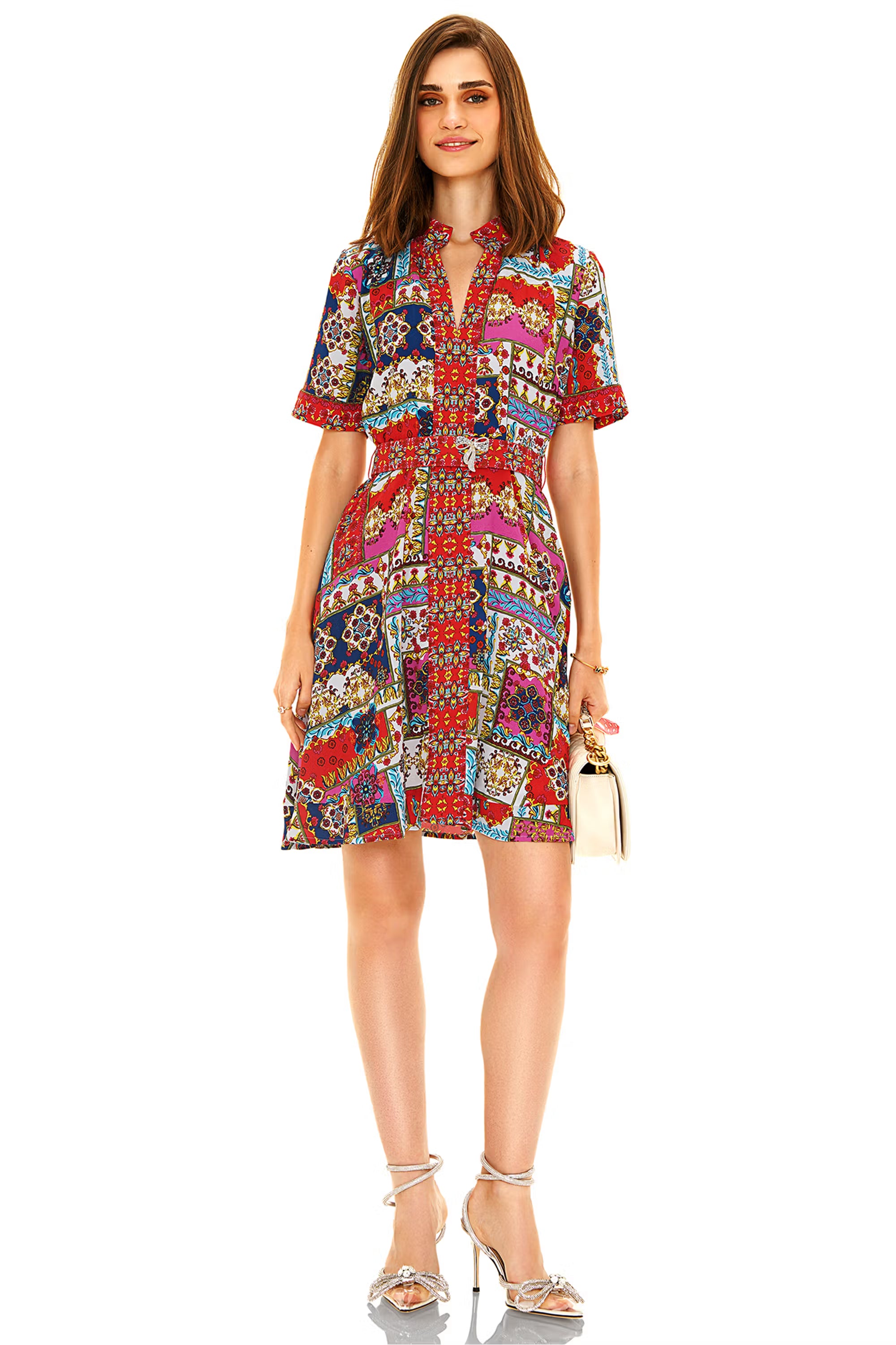 Red multicolor printed shirt mini dress  with short sleeves and button-down, styled with heels.