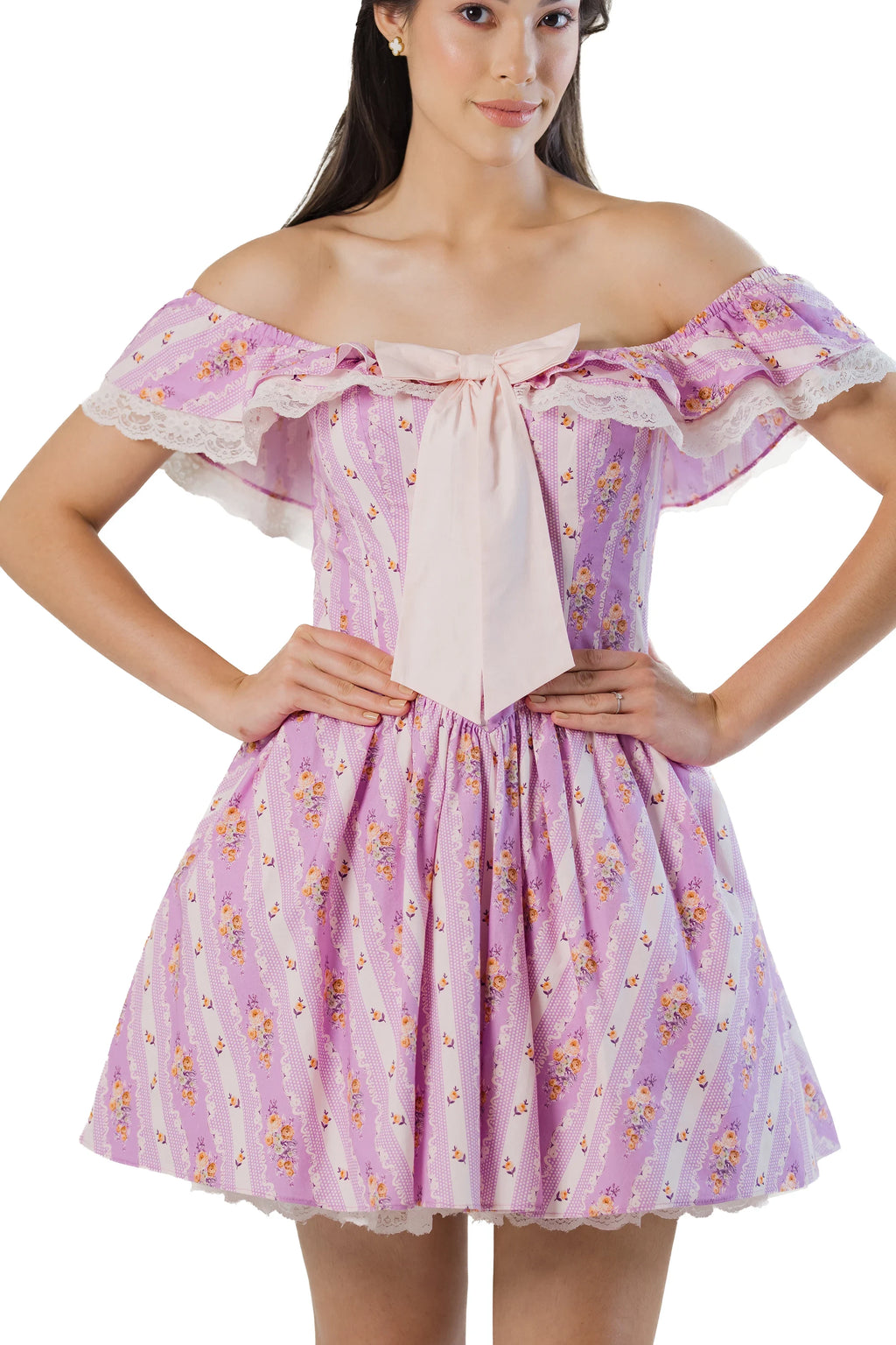 Close-up: oversized bow and lace-ruffle neckline on purple off-shoulder mini