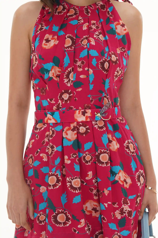 Close-up of Pretty Pixie raspberry sorbet floral belted halter mini dress