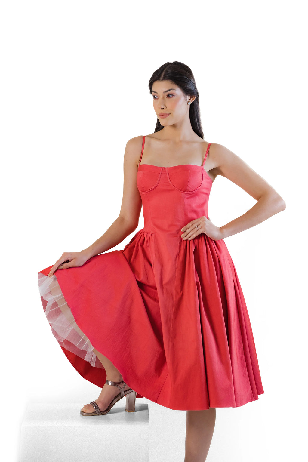 Red cotton midi dress showing twirl movement — flared skirt with tulle underskirt, strappy bustier top