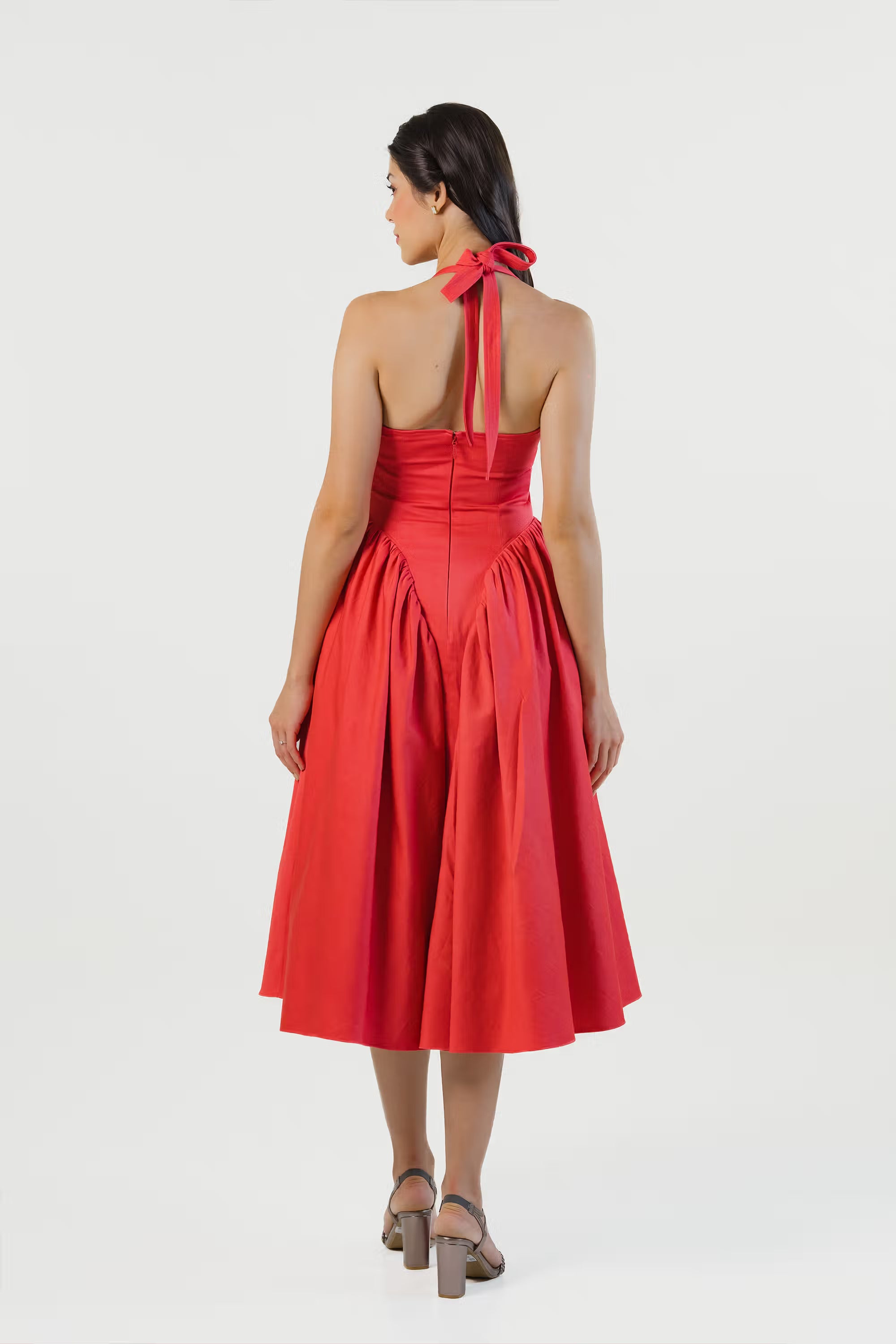 Full back view of red halter midi dress with A-line skirt and tie strap detail