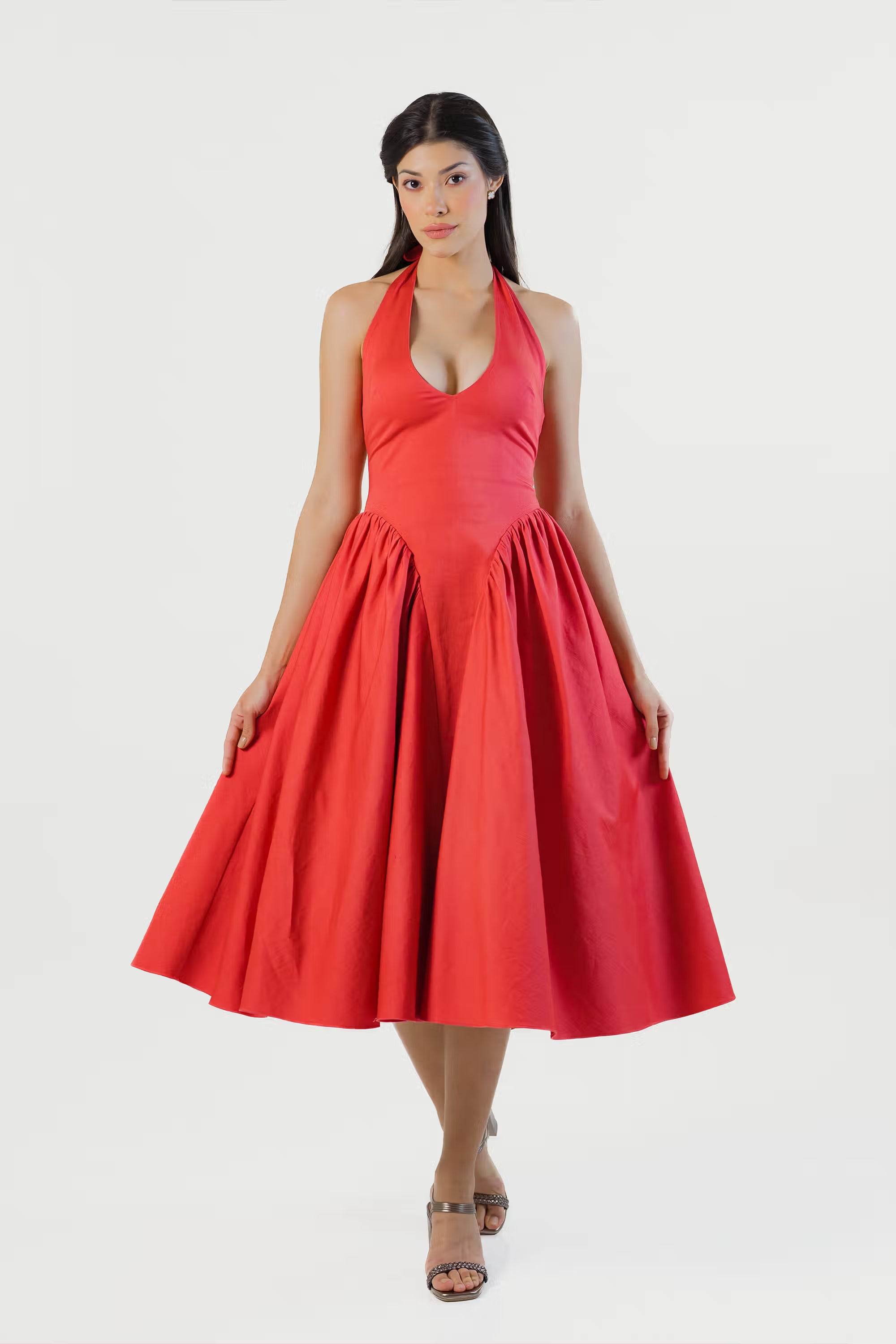 Women wearing red halter midi dress front view with flared skirt and sleeveless design