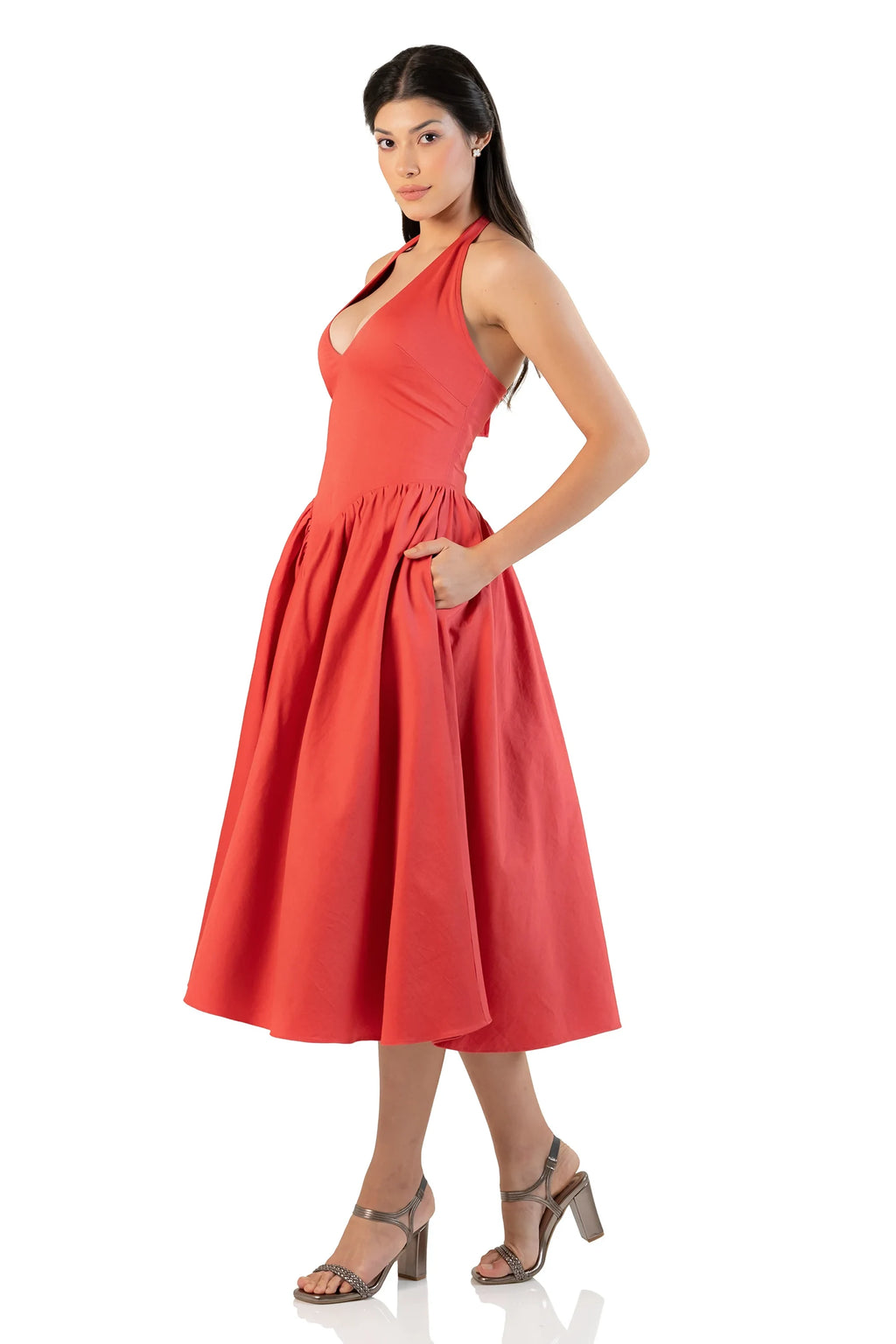 Side view showing pockets on red halter midi dress