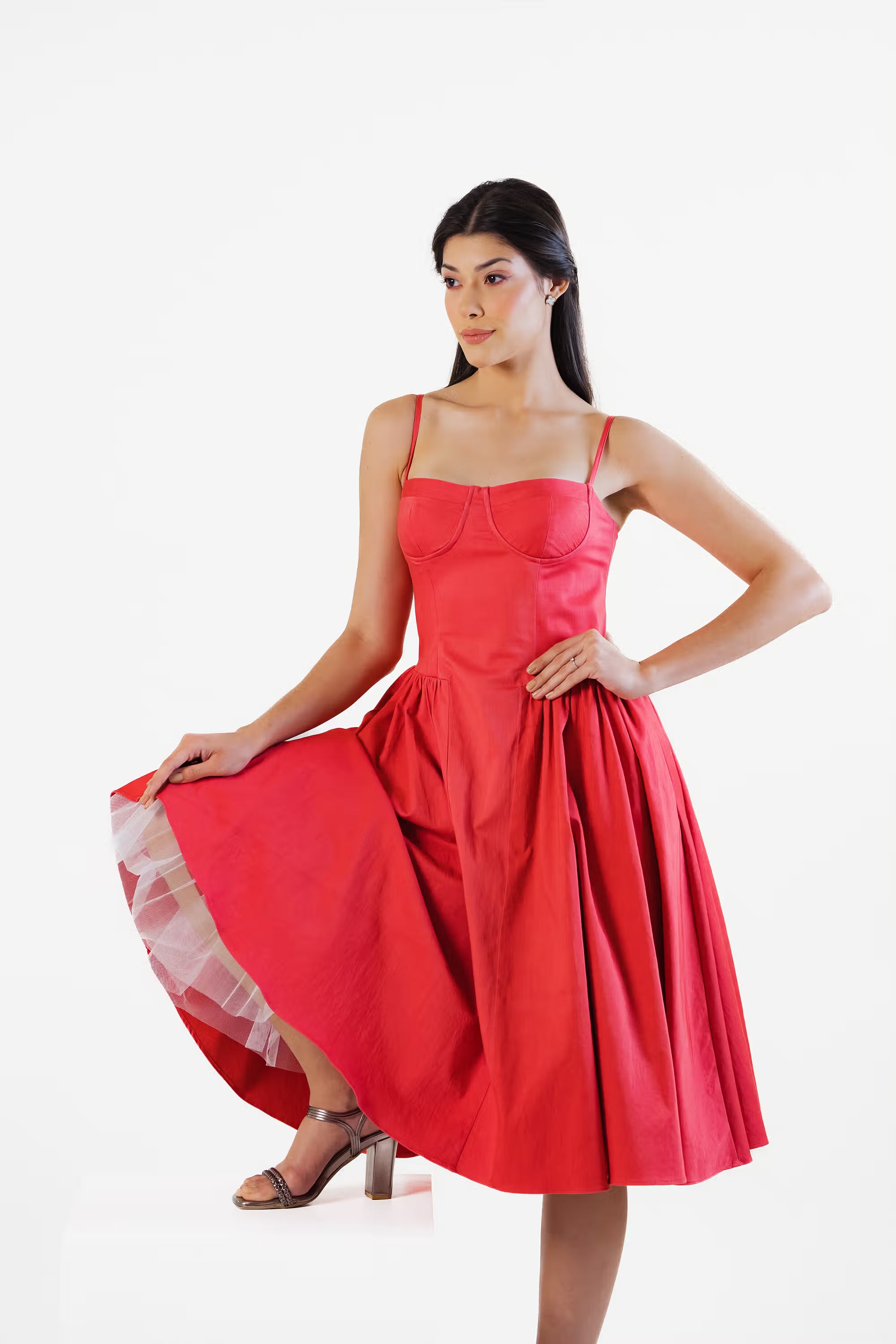 Side angle of red corset midi dress with flared hem and feminine silhouette