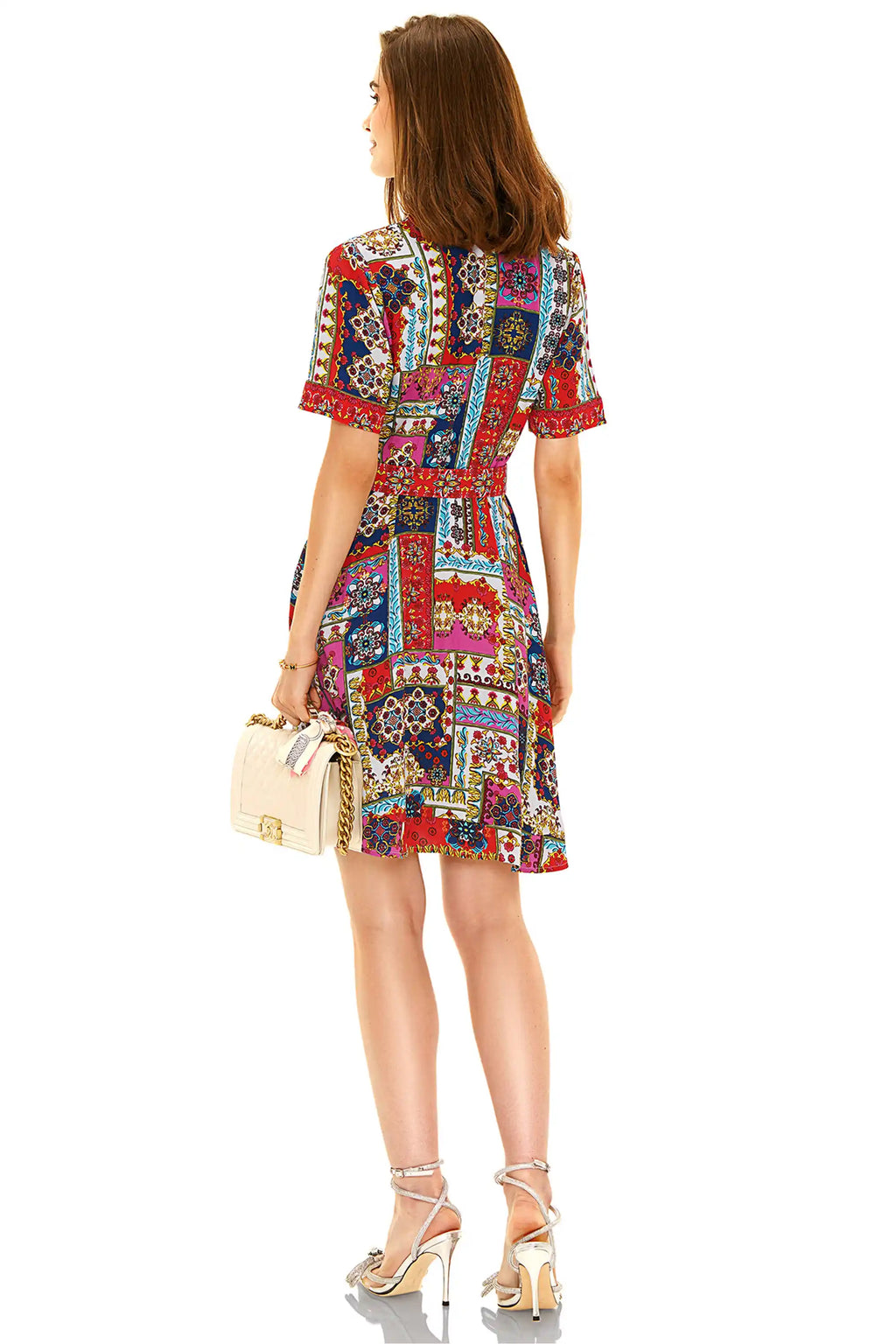 Back view of red multicolor printed shirt mini dress featuring vibrant patchwork design and waist detail.