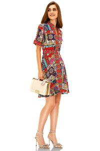 Red multicolor printed shirt mini dress side view with short sleeves and button-down front, styled with heels.