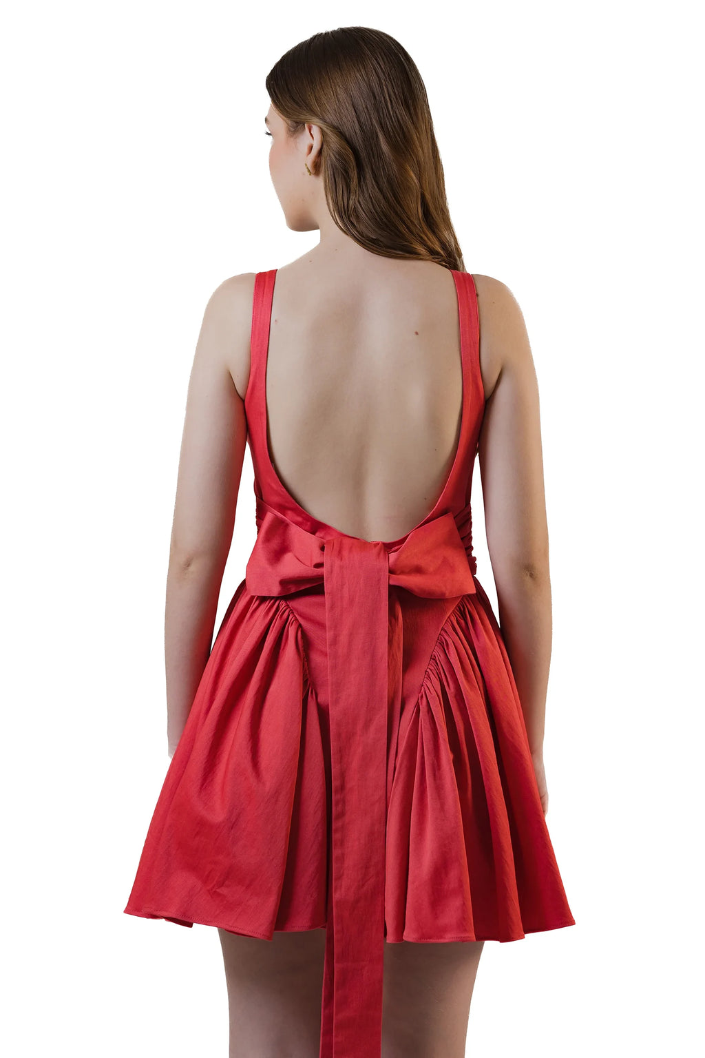 Back view with long bow on red open-back mini dress
