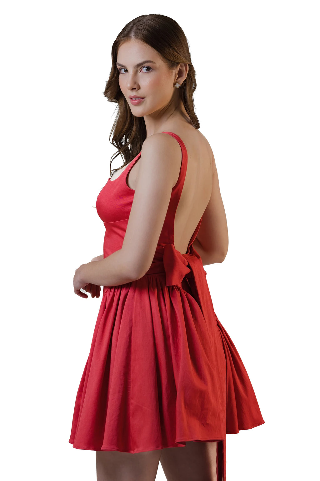 Back angle showing low open back and bow on red mini dress