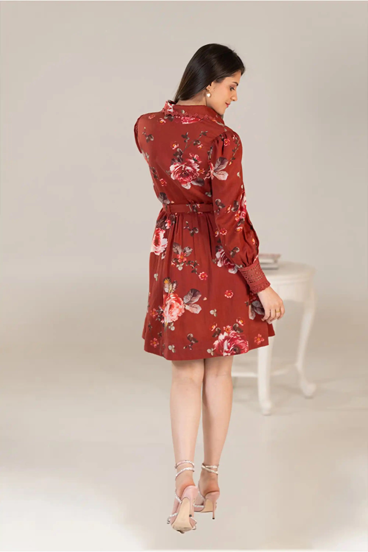 Back view of rust red floral shirt dress with belt