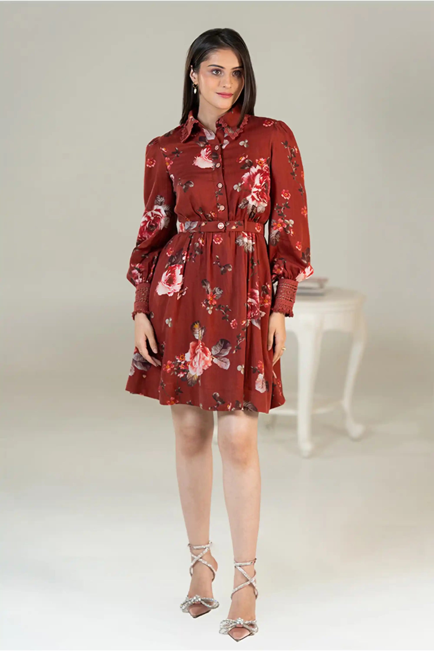 Front view of rust red floral shirt dress with waist belt