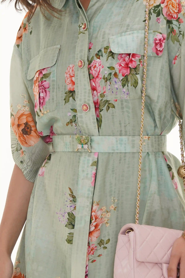Close-up of Pretty Pixie sage floral belted shirt mini dress