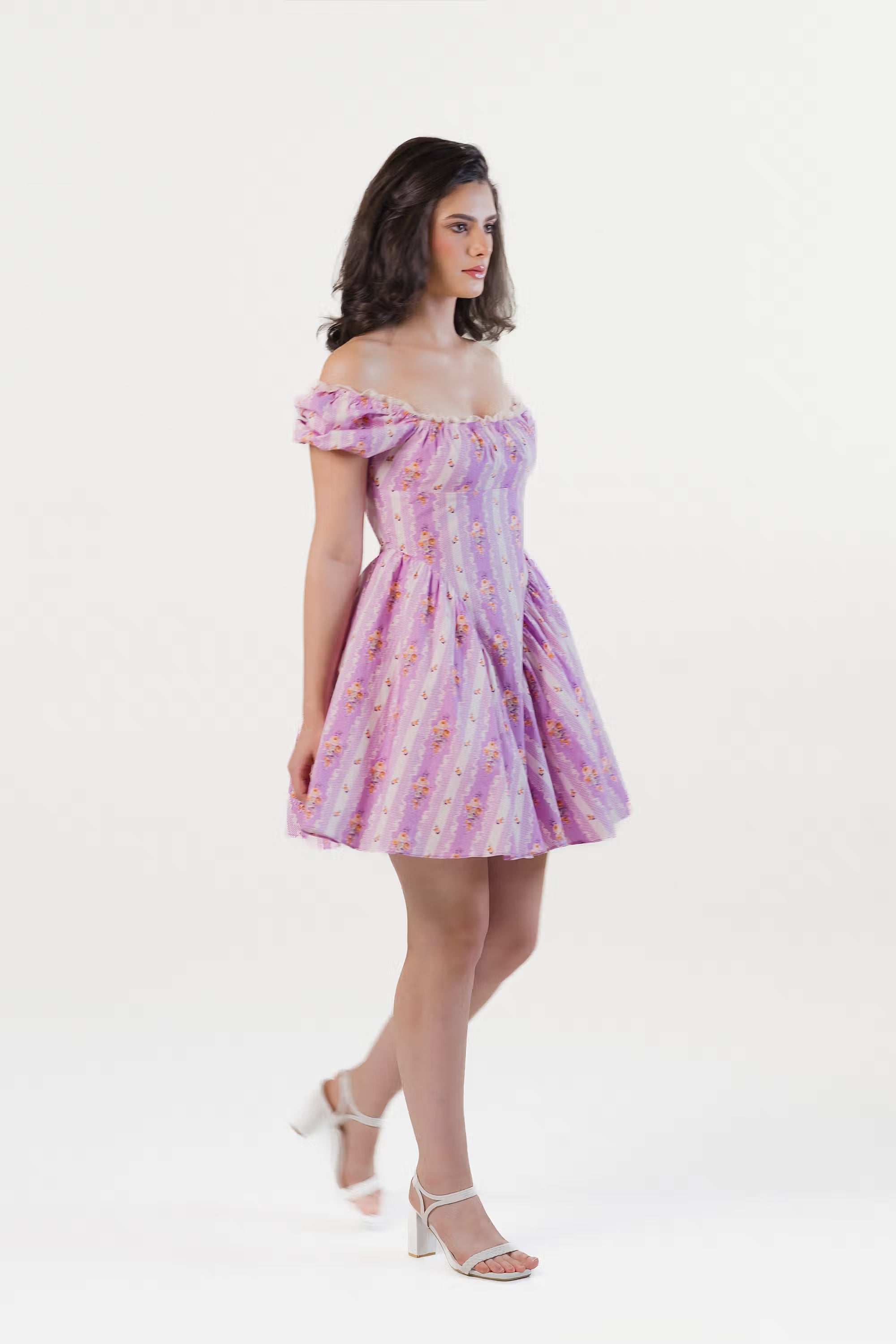 Side angle of lavender puff sleeve mini dress with vintage floral print.