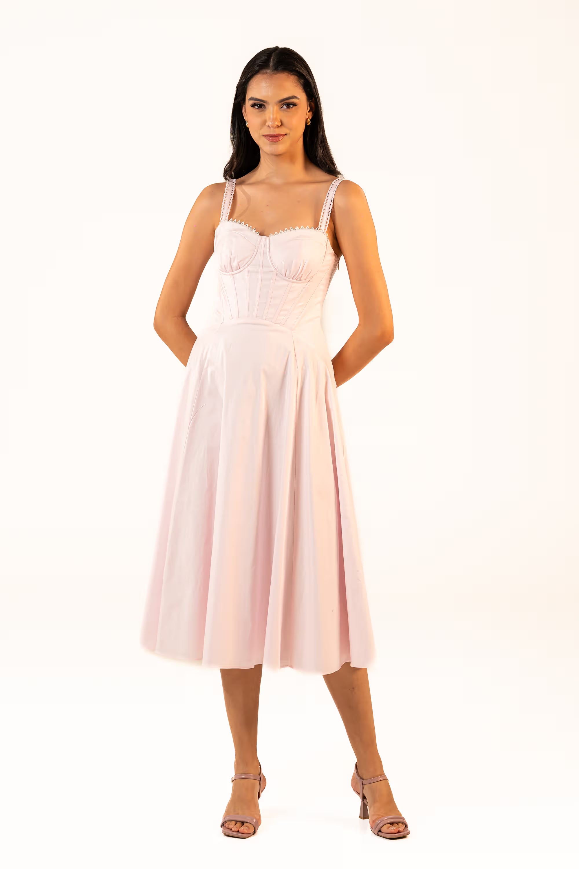 Front view of a soft pink corset-style midi dress with fitted bodice and flared skirt, perfect for formal occasions.