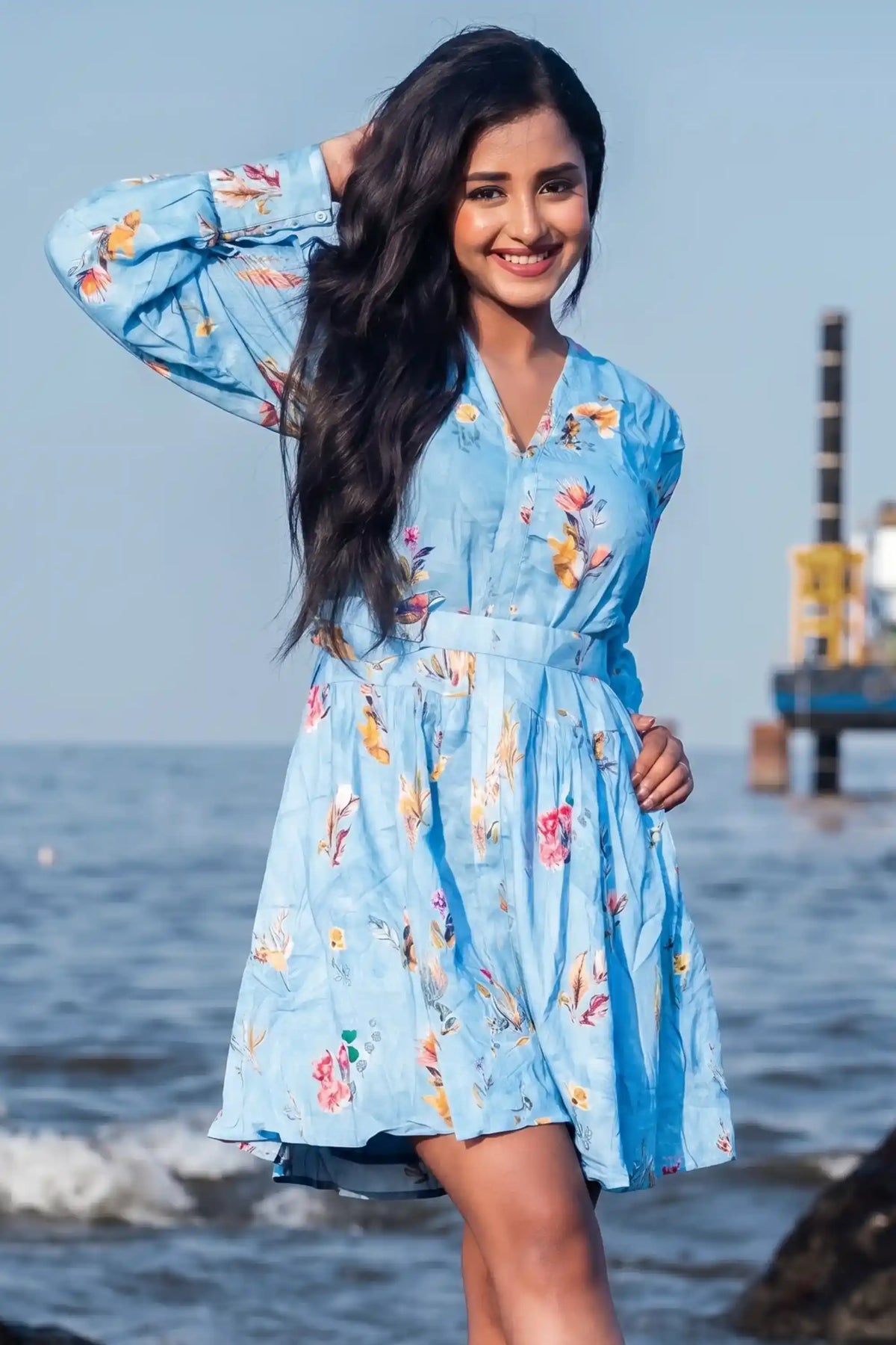 Tina Ann Philip in PrettyPixie sky blue floral belted v-neck mini dress