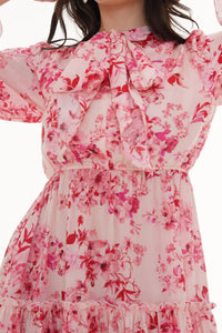 Close-up of Pretty Pixie turquoise floral mini dress