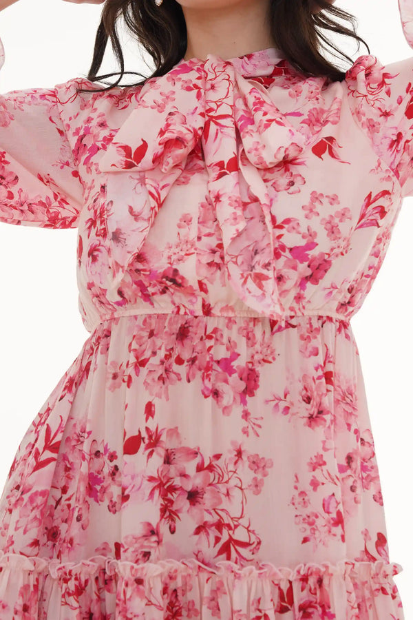 Close-up of Pretty Pixie turquoise floral mini dress