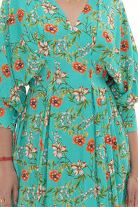 Close-up of Pretty Pixie turquoise floral belted puff-sleeve mini dress