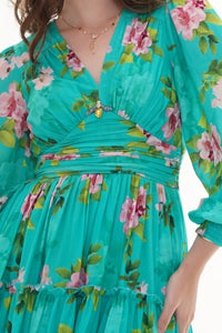 Close-up of Pretty Pixie turquoise floral belted puff-sleeve mini dress, fabric detail