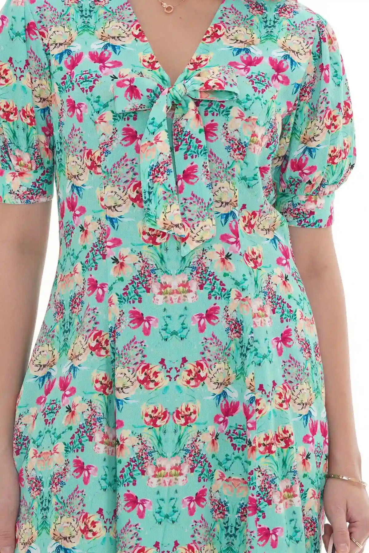 Close-up of Pretty Pixie turquoise floral V-neck puff-sleeve mini dress