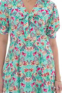 Close-up of Pretty Pixie turquoise floral V-neck puff-sleeve mini dress