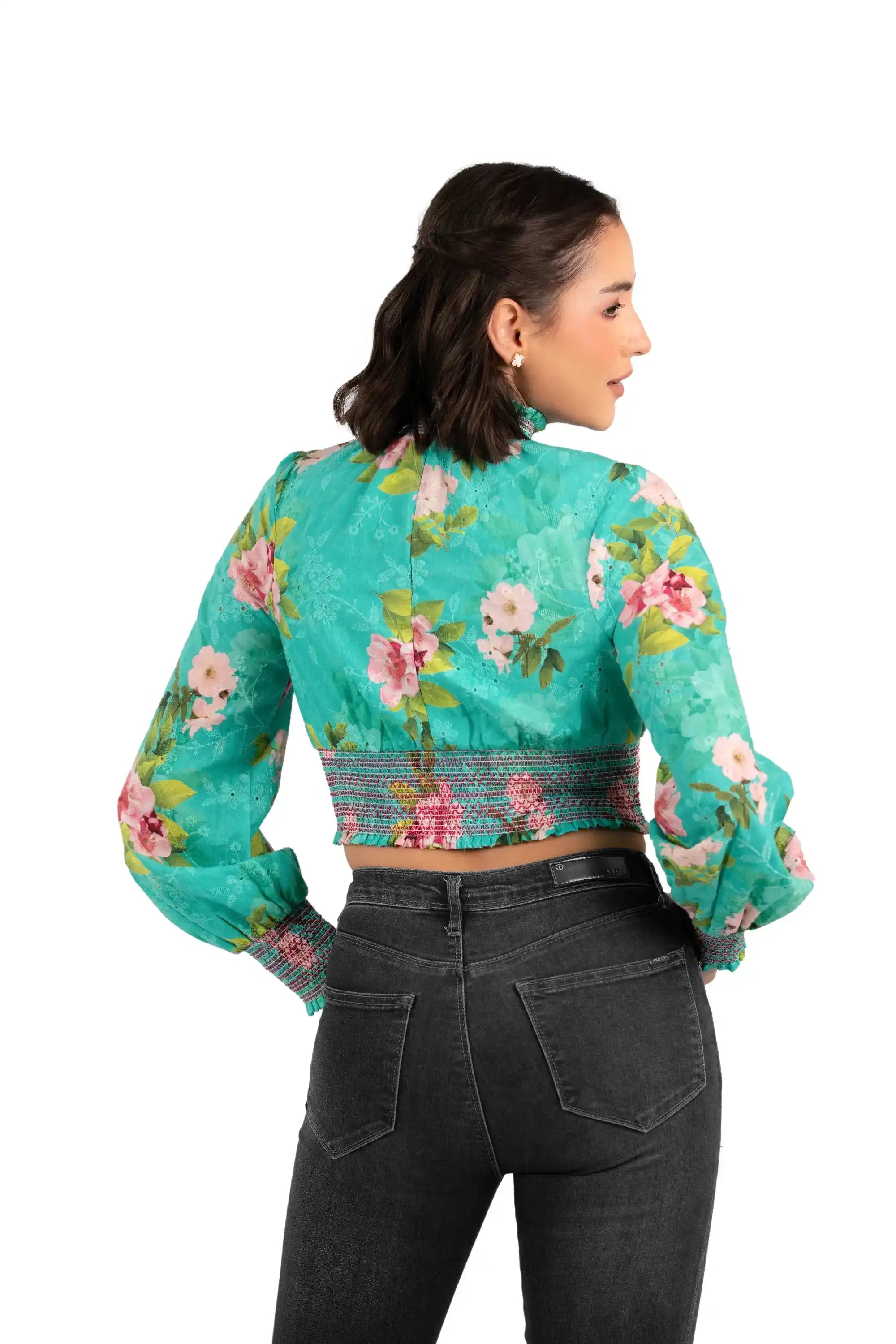 Back view of women's turquoise floral smocked crop top, long sleeves, high neck