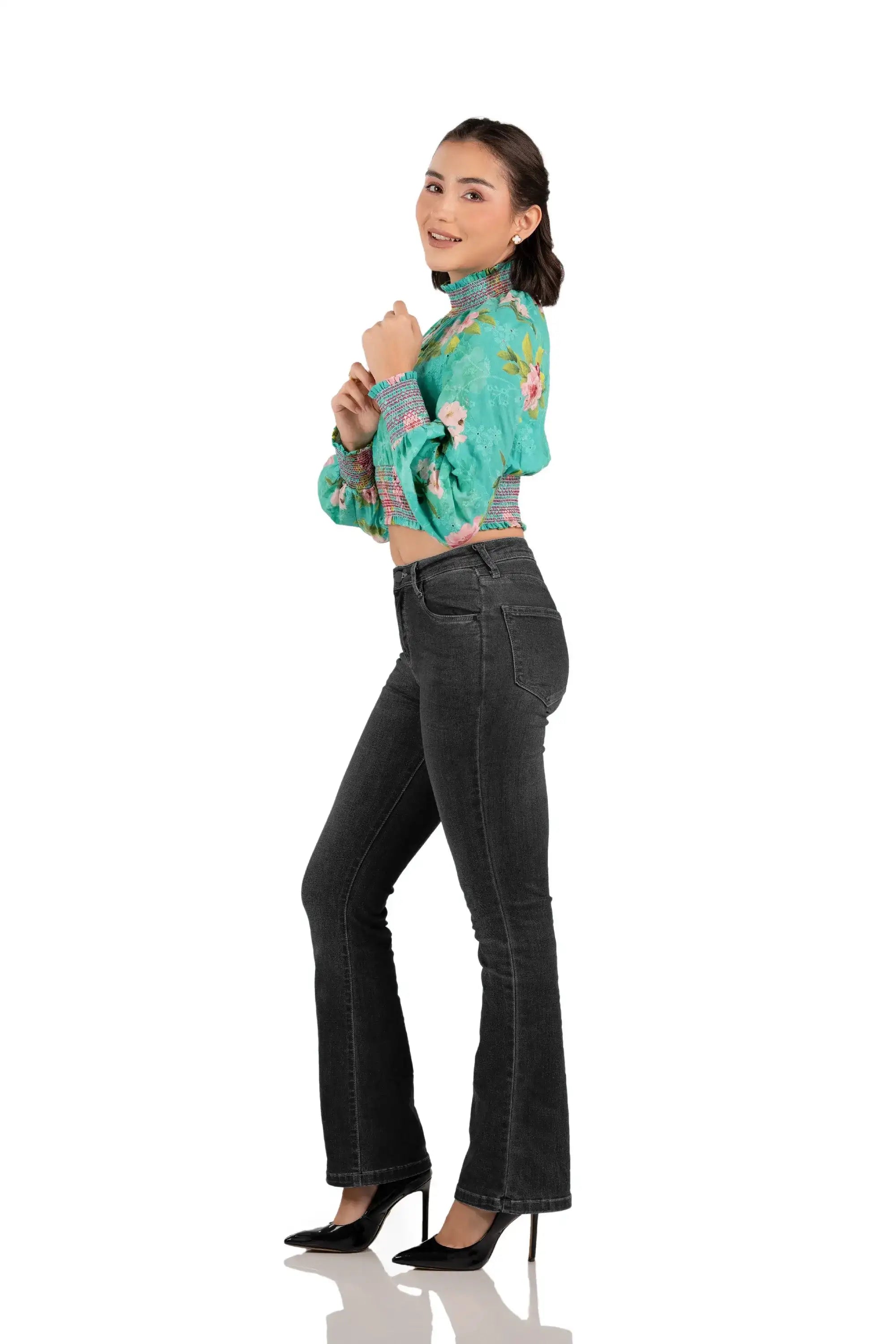Left side view of women's turquoise floral smocked crop top with balloon sleeves