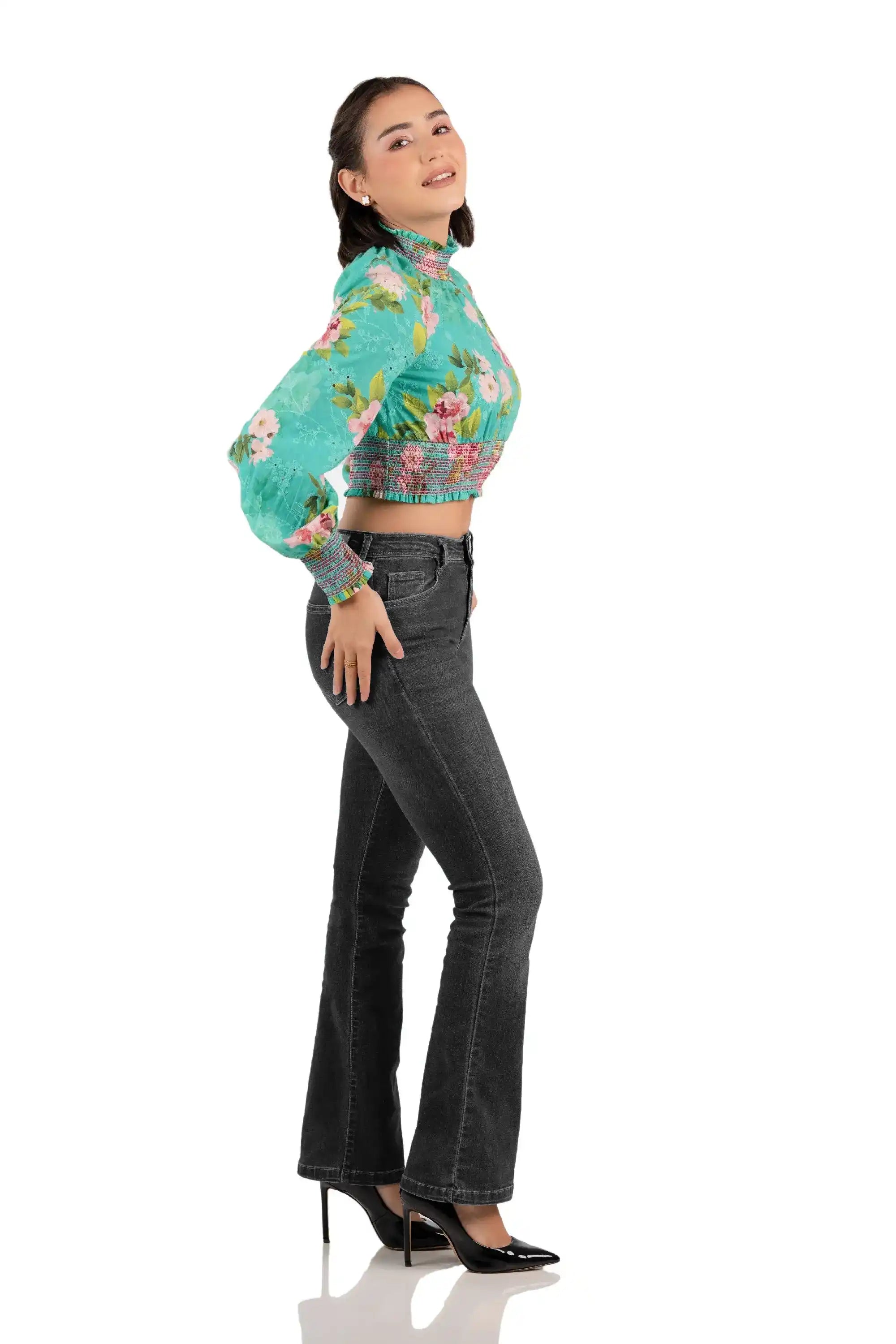 Right side view of women's turquoise floral smocked crop top, high neck, long sleeves