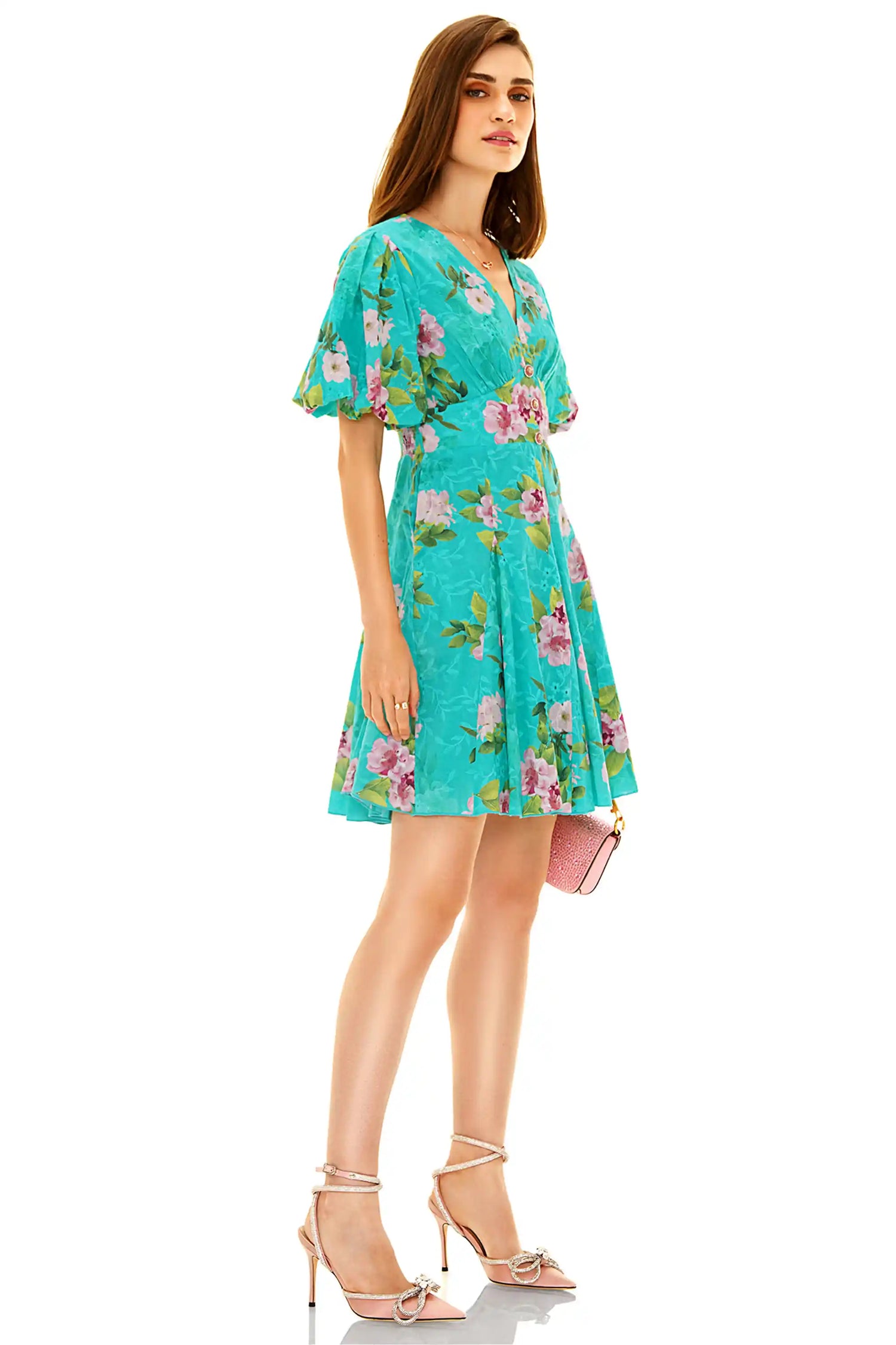 Side view of turquoise floral mini dress with v-neck and puff sleeves