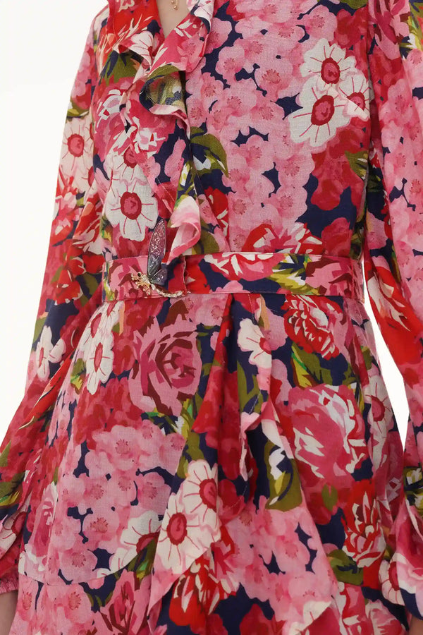 Close-up of Pretty Pixie twilight rose navy floral ruffle hi-low midi dress