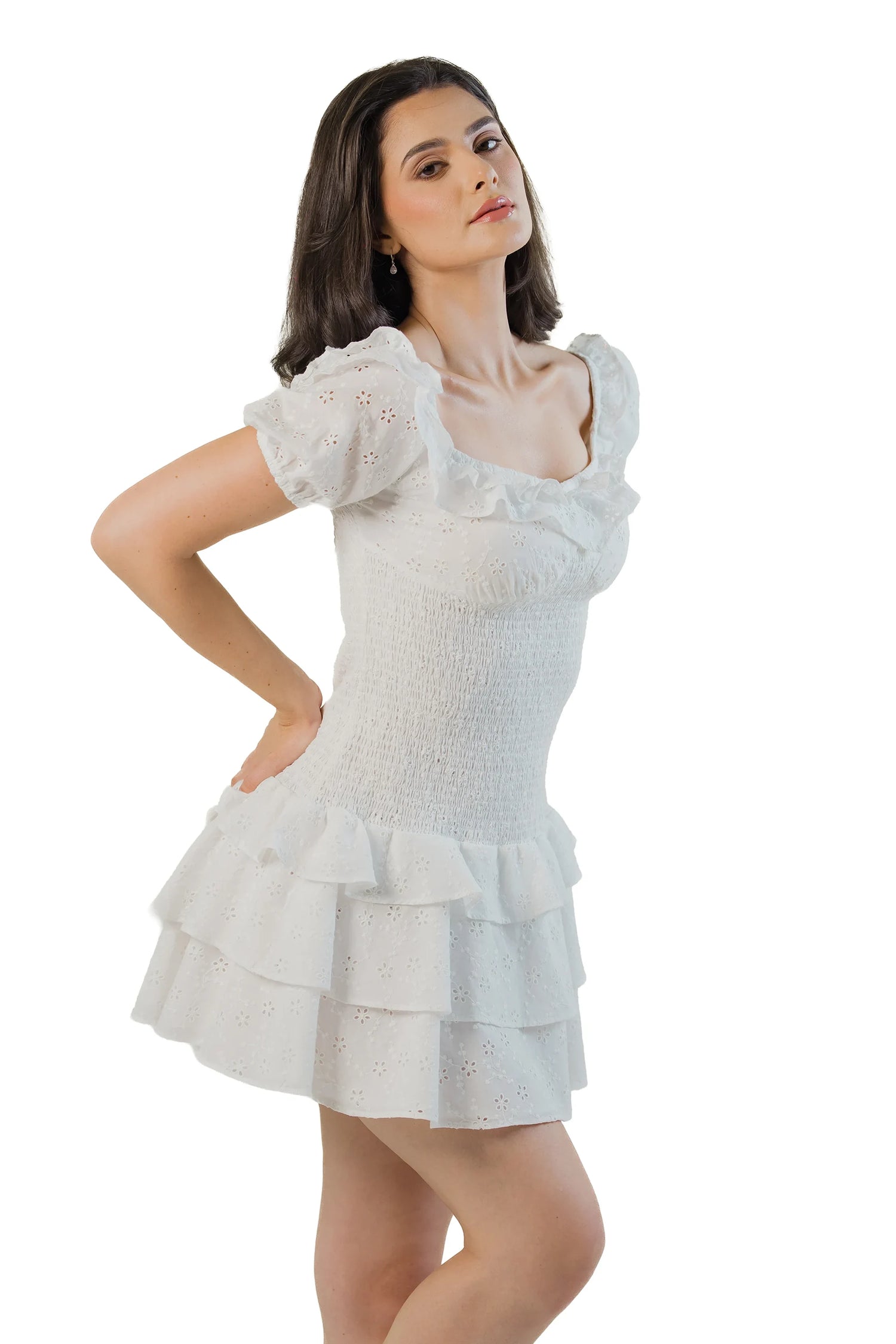 Front angle: white cotton eyelet mini with ruffle sleeves, smocked bodice