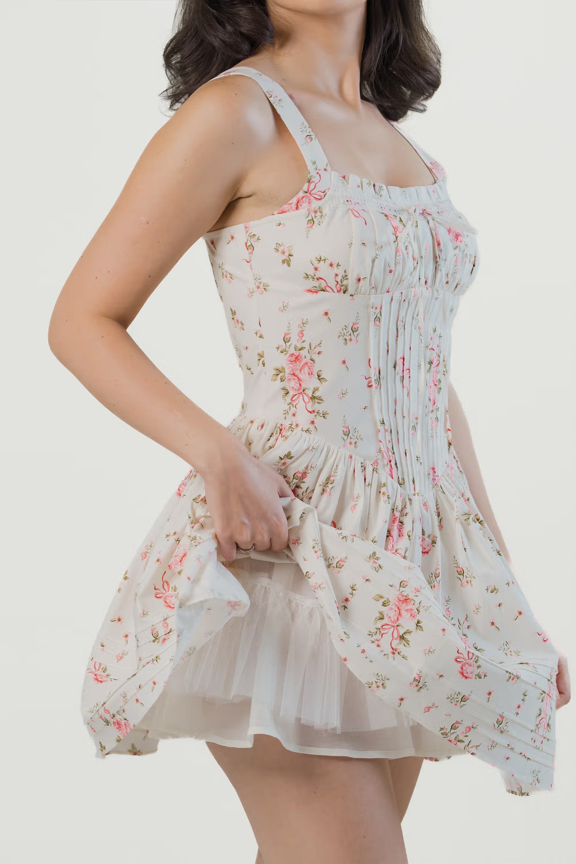 White floral corset mini dress lifted to reveal inner tulle underskirt for added volume