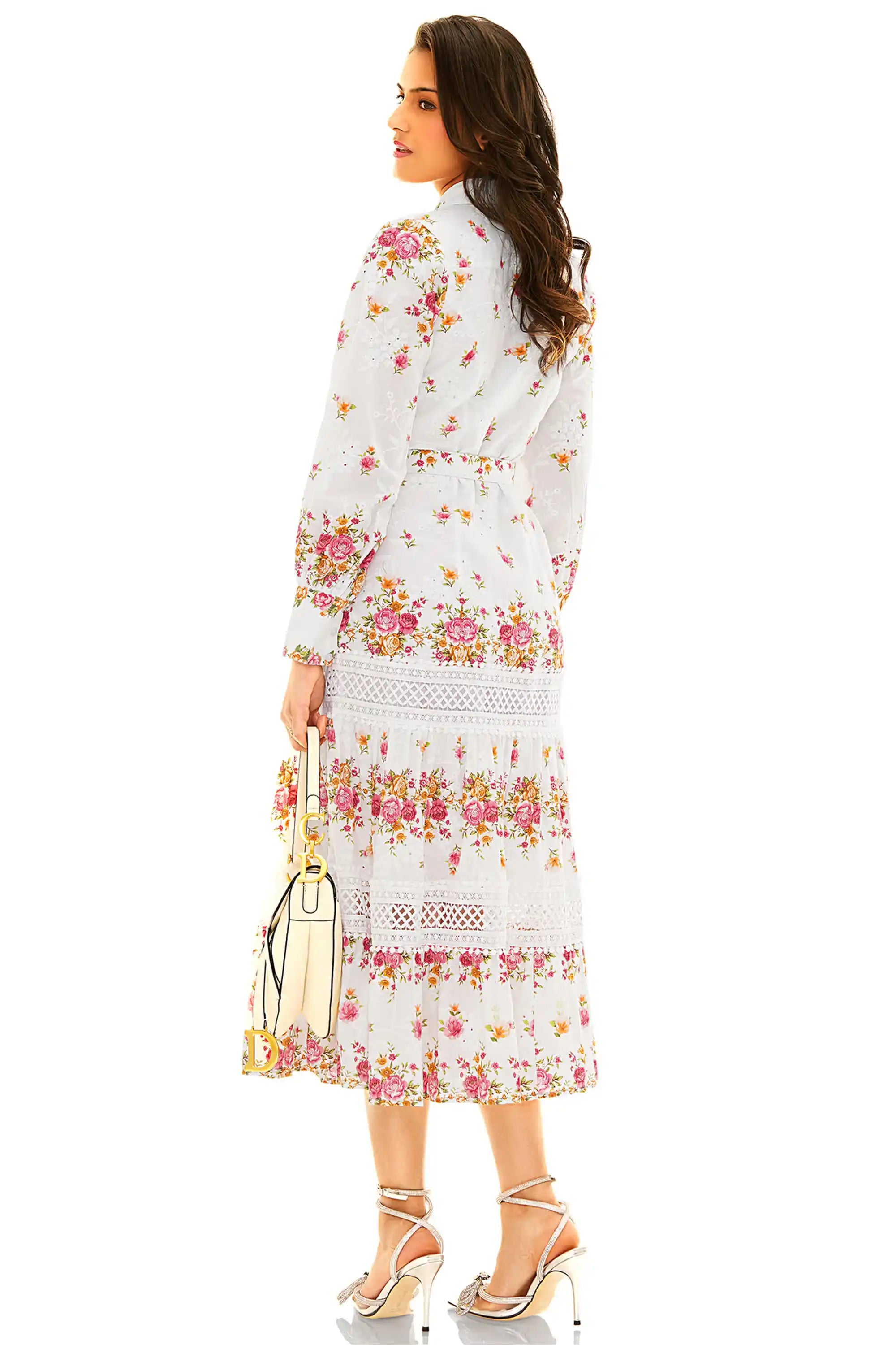 Back view of white floral lace tiered midi dress featuring button-down detail and florals
