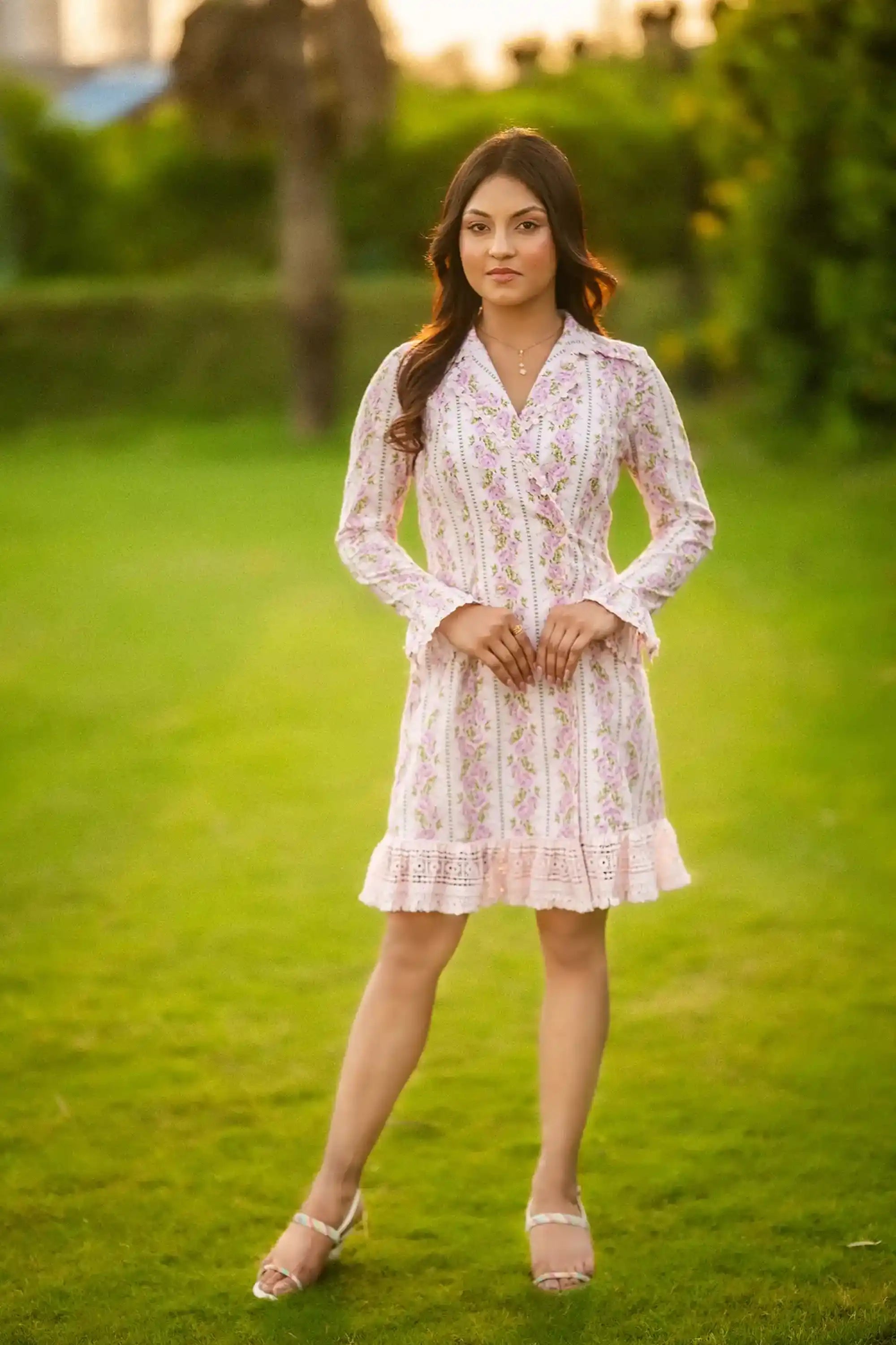 White mini dress with pink floral print and lace trim front view